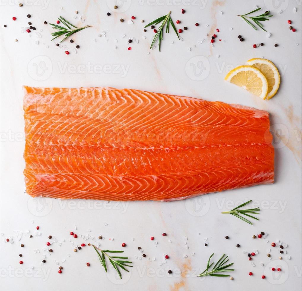 Food background, salmon steaks and seasonings photo