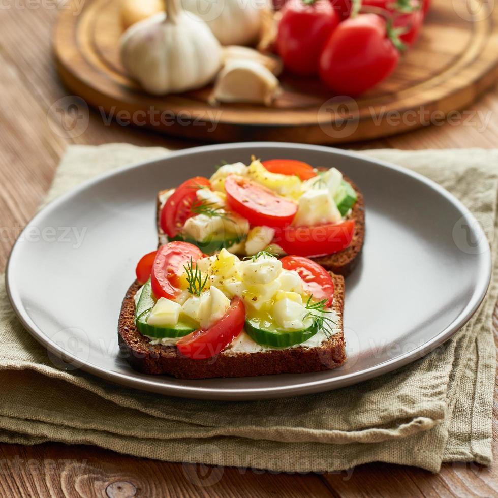 Smorrebrod - traditional Danish sandwiches. Black rye bread with boiled egg photo