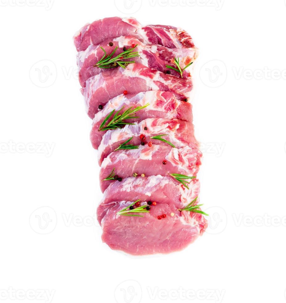 pork meat slices loin with seasoning on white background, top view photo