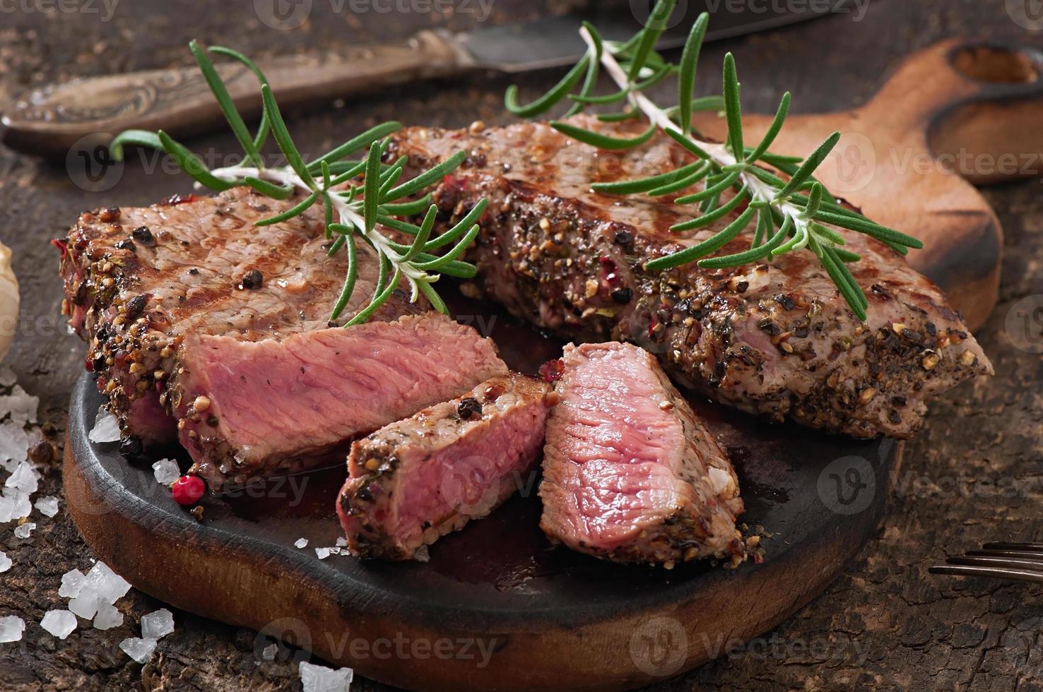 Juicy steak medium rare beef with spices photo