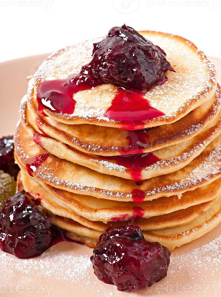 Delicious pancakes with strawberry jam photo