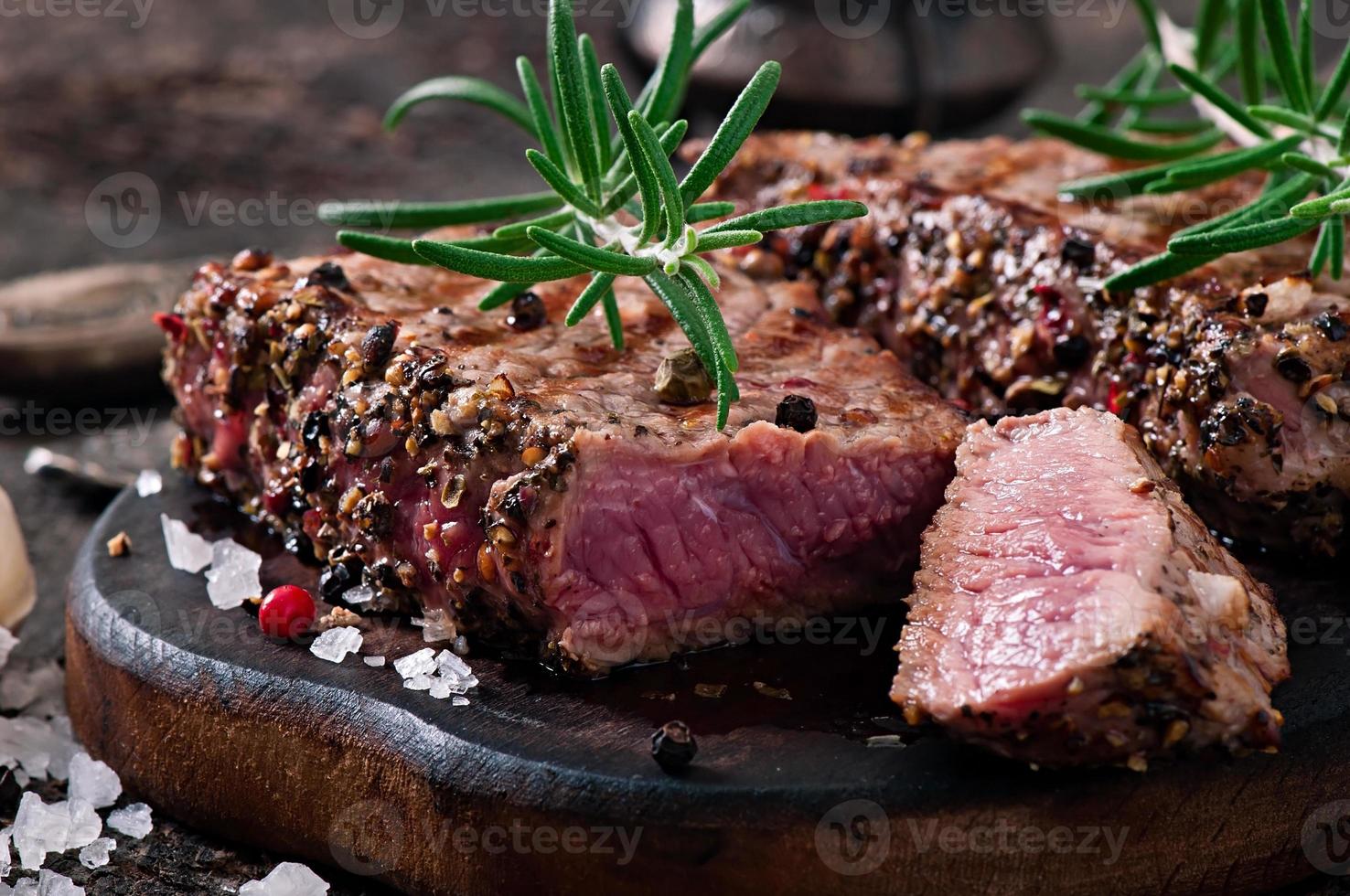 Juicy steak medium rare beef with spices photo