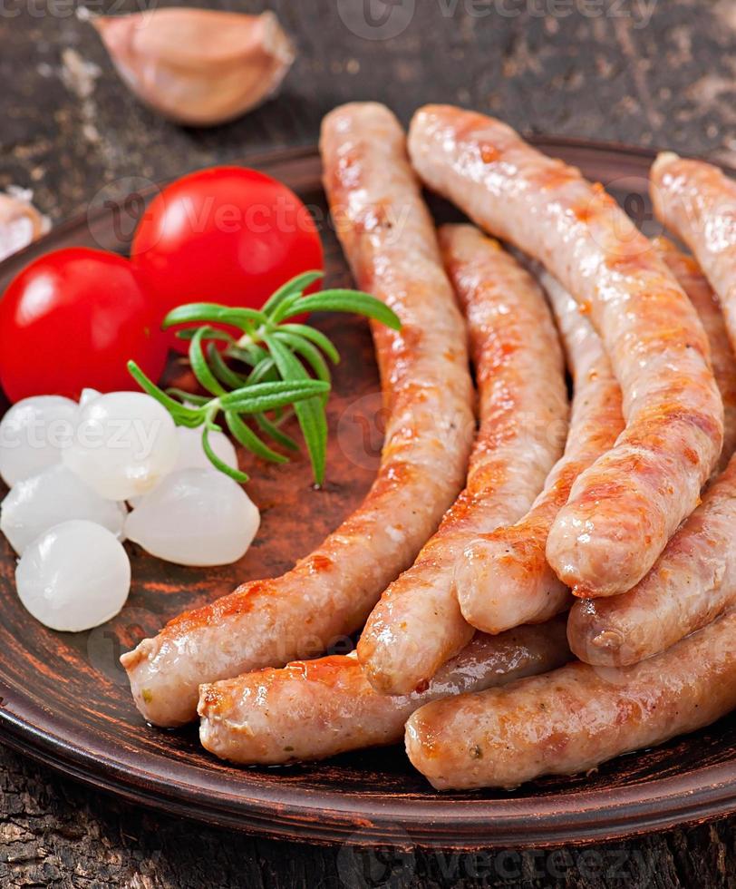 Tasty grilled sausages photo