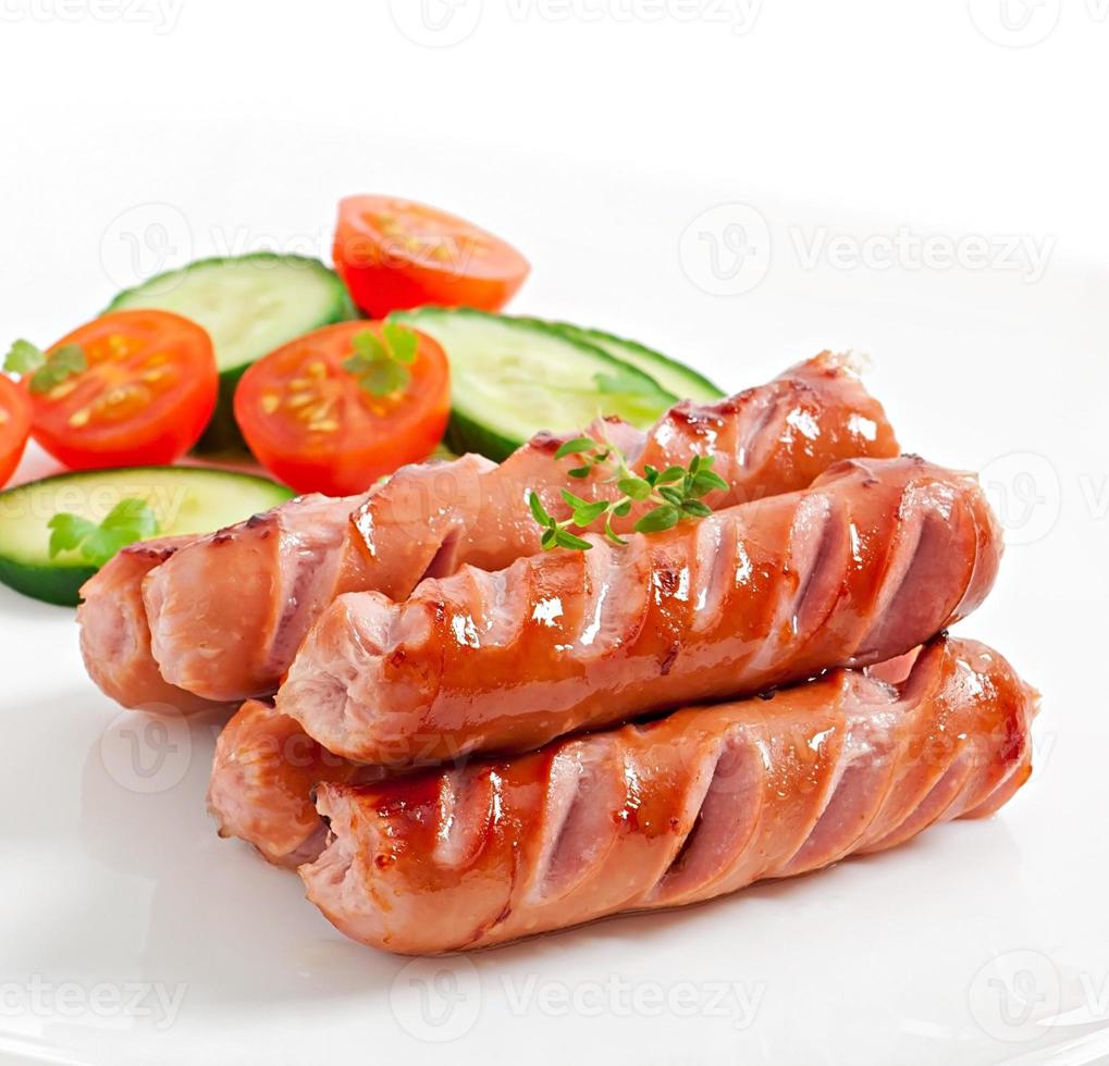 sausages on the grill and salad photo