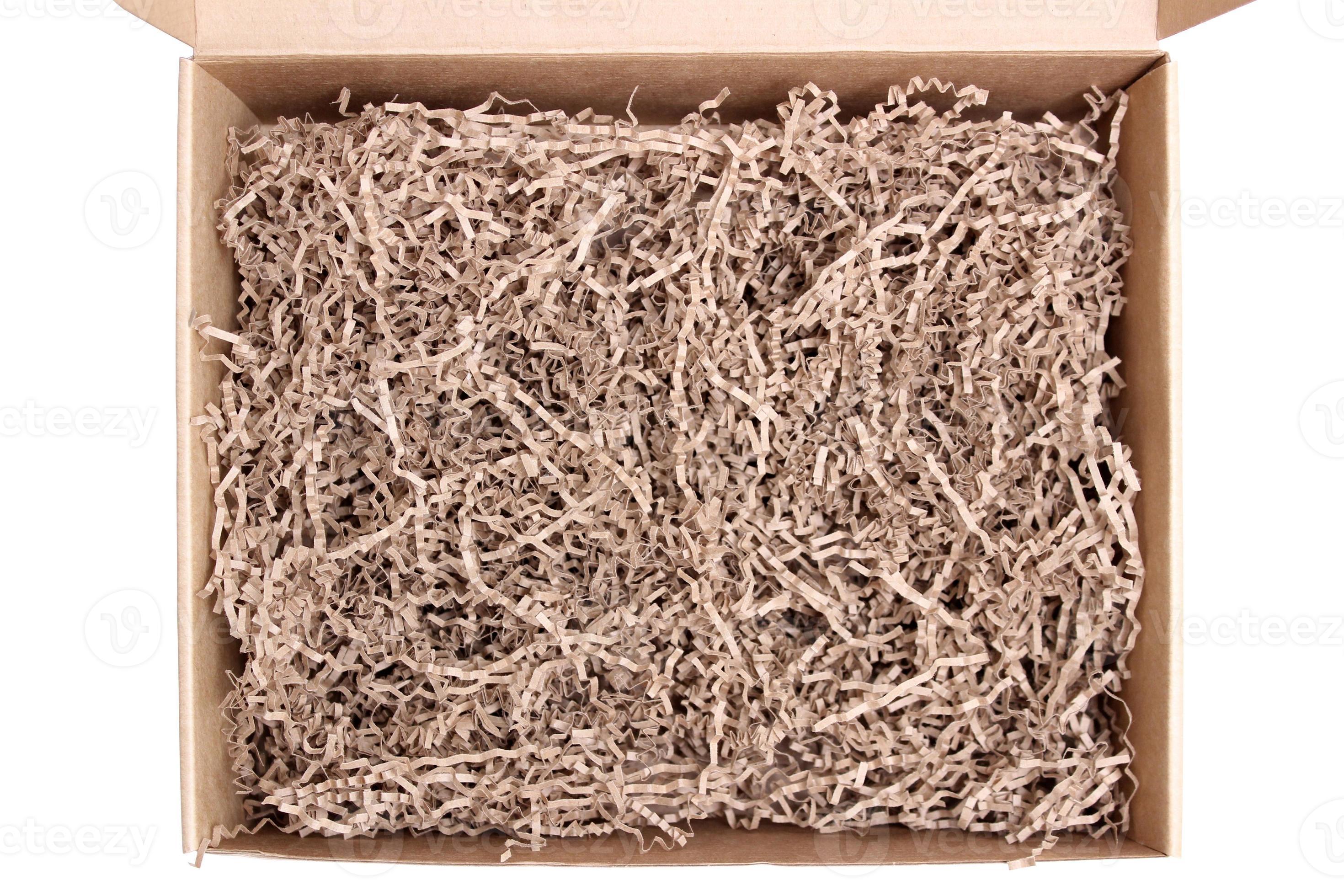 Opened cardboard posting and shipping box with crinkle tissue paper