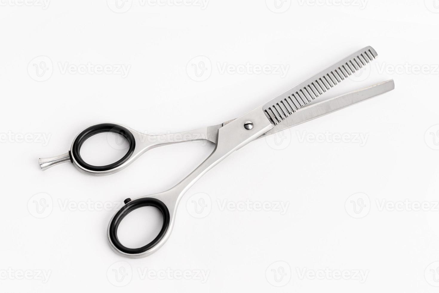 Barber scissors for sculpting isolated on white background. Stylish professional hairdressing scissors photo