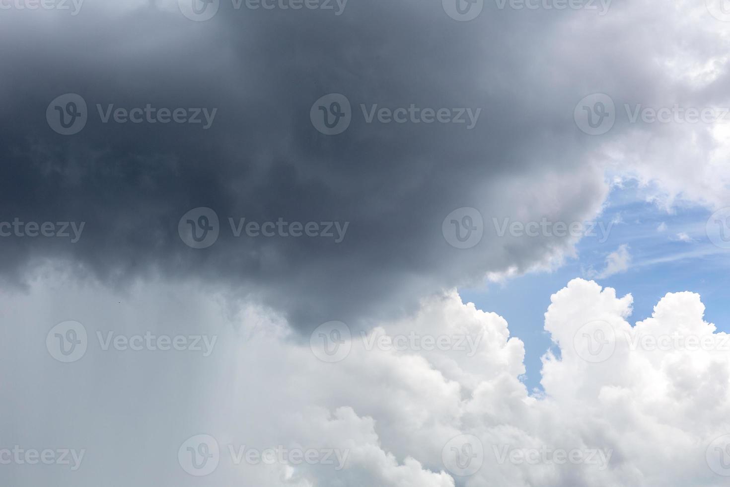 Rain cloud. Weather change. Different climatic situations in a single image. photo