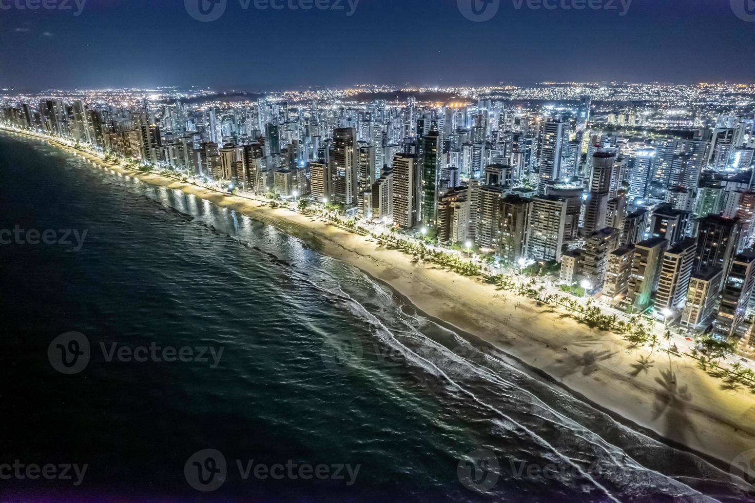 Aerial view of Boa Viagem beach in Recife, capital of Pernambuco, Brazil at night. photo