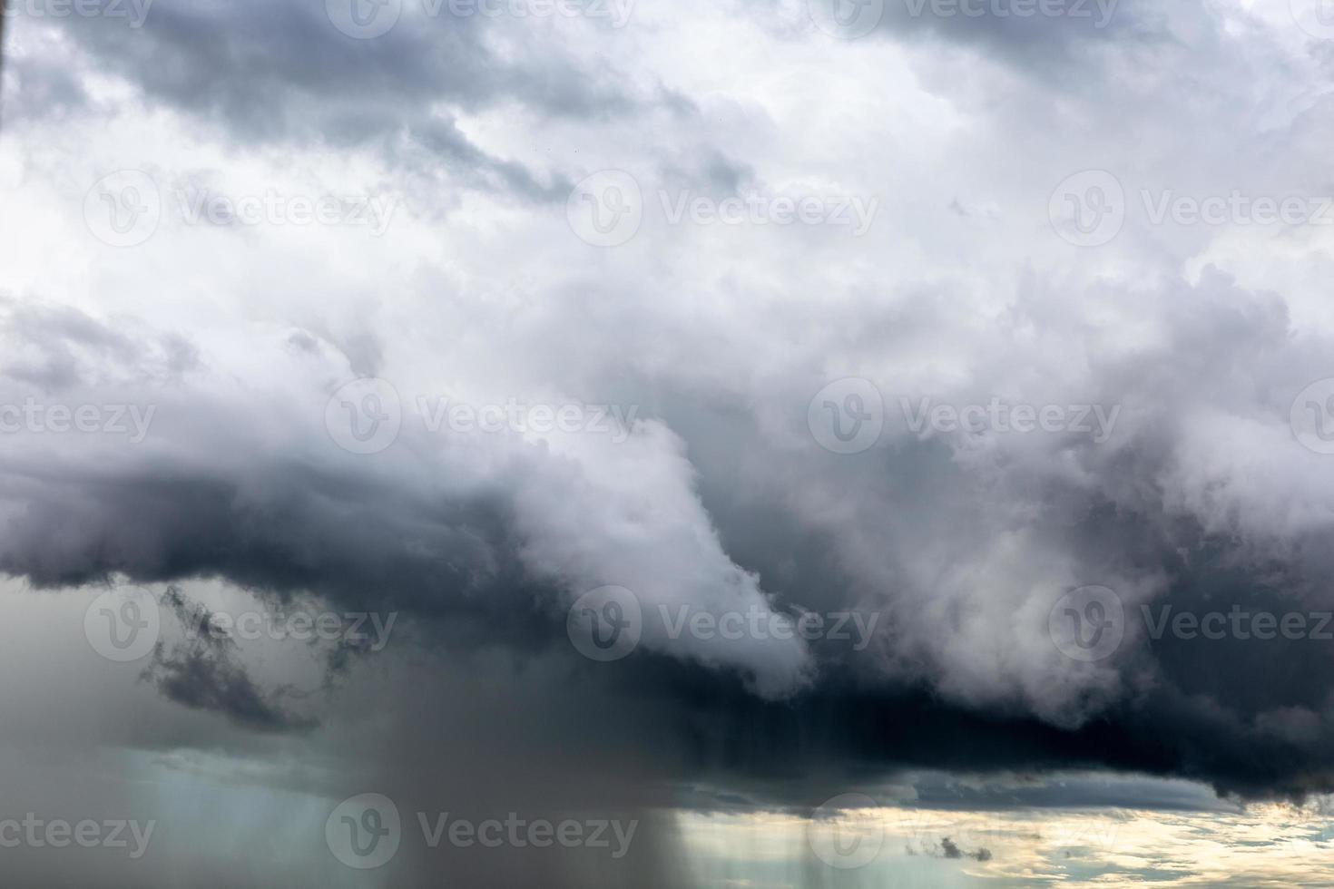 Rain cloud. Weather change. Different climatic situations in a single image. photo