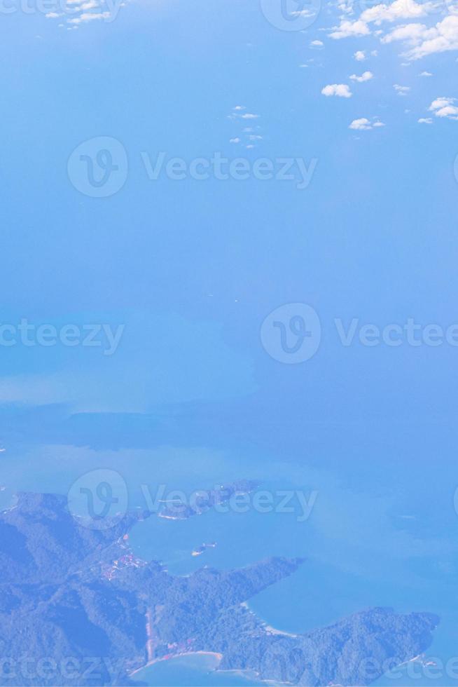 Flying over Thailand panoramic view of islands beaches turquoise waters. photo