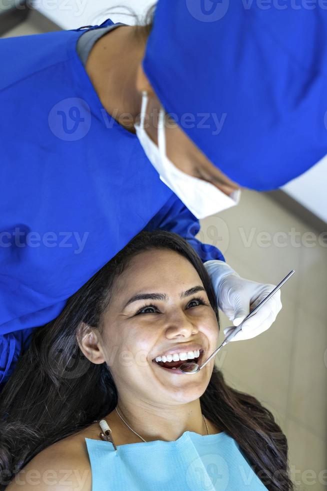 Beautiful patient smiling at doctor. photo