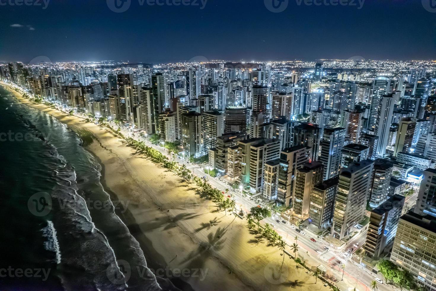 Aerial view of Boa Viagem beach in Recife, capital of Pernambuco, Brazil at night. photo