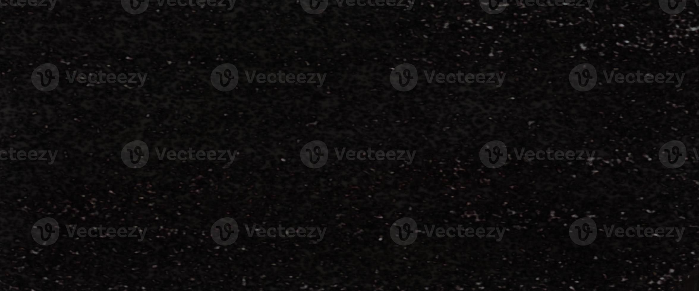 sand stone wall black color rough surface texture material background dot white pattern photo