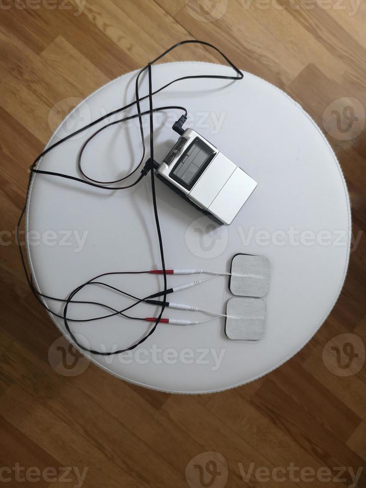 Electrical Stimulation Therapy on white chair, ElectroAcupuncture Dual