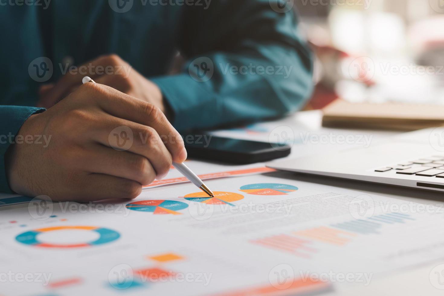 male executive analyzing and planning business sales performance from financial data, analyzing finance sales data and economic growth graph chart. photo