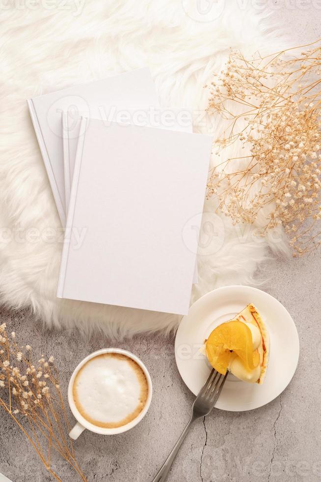 blank calendar mockup with carrot cake dessert, coffee and flowers on white rug photo