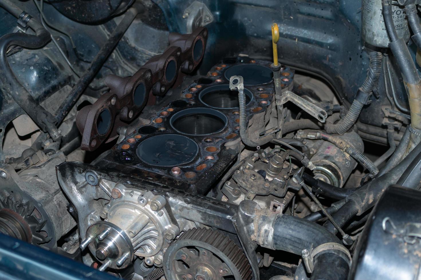 The mechanic is checking the engine. photo