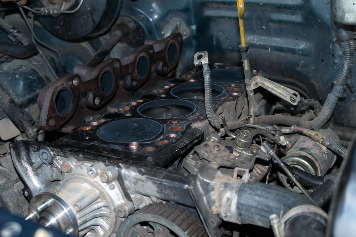 The mechanic is checking the engine. photo