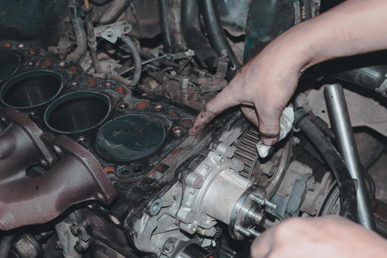 The mechanic is checking the engine. photo