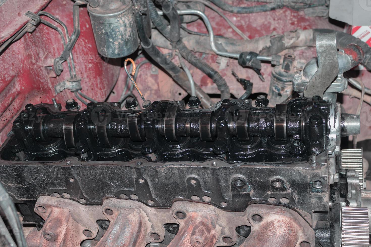 The mechanic is checking the engine. photo