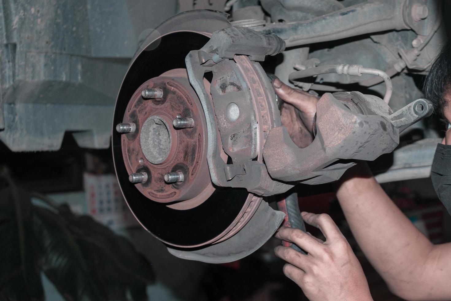 The mechanic is checking the engine. photo