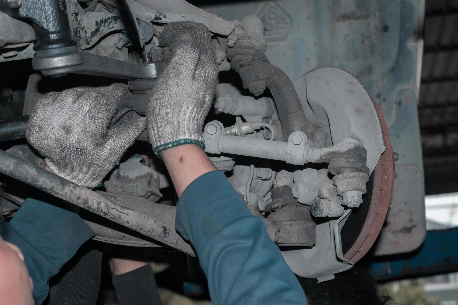 The mechanic is checking the engine. photo
