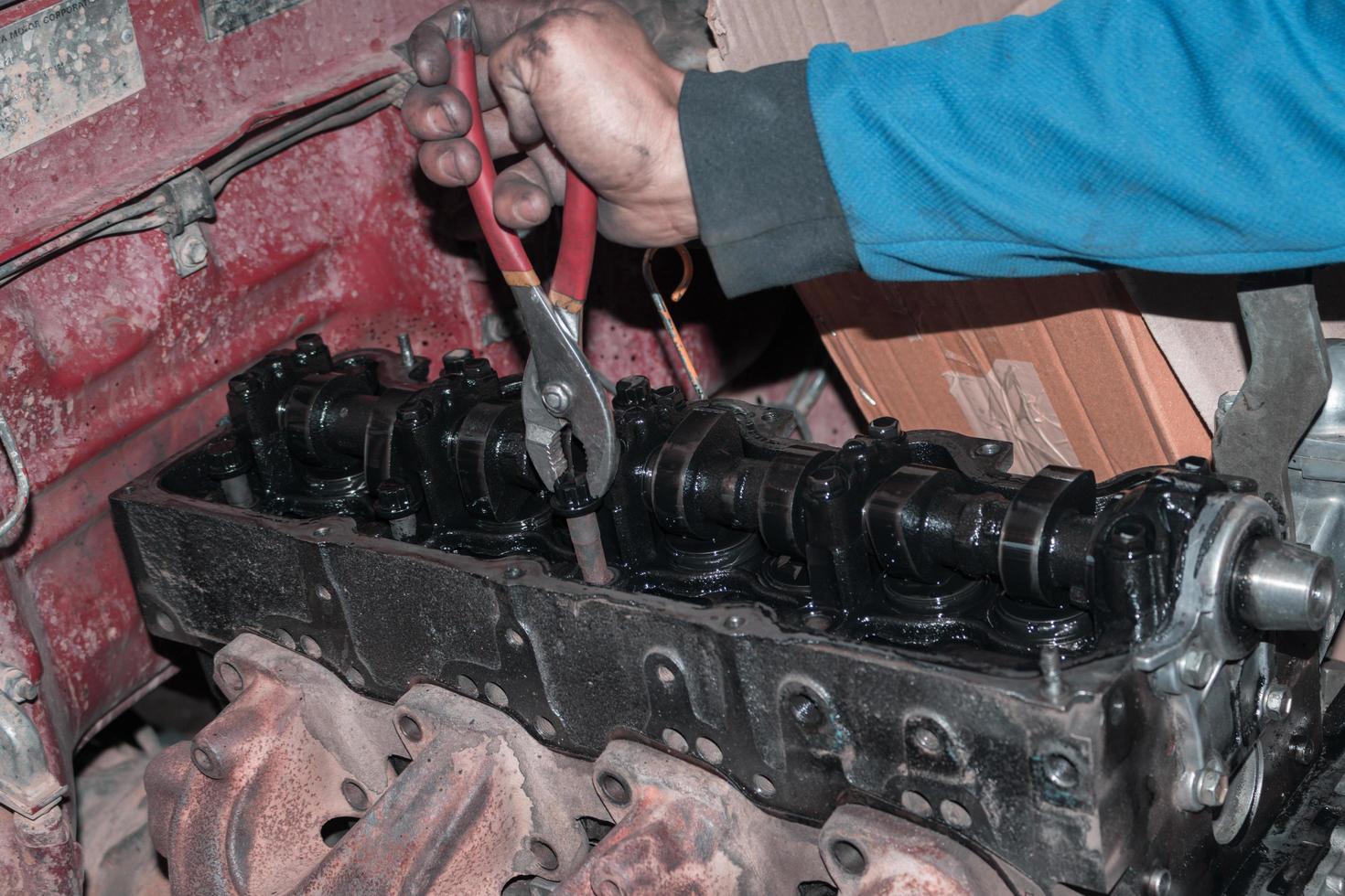 The mechanic is checking the engine. photo