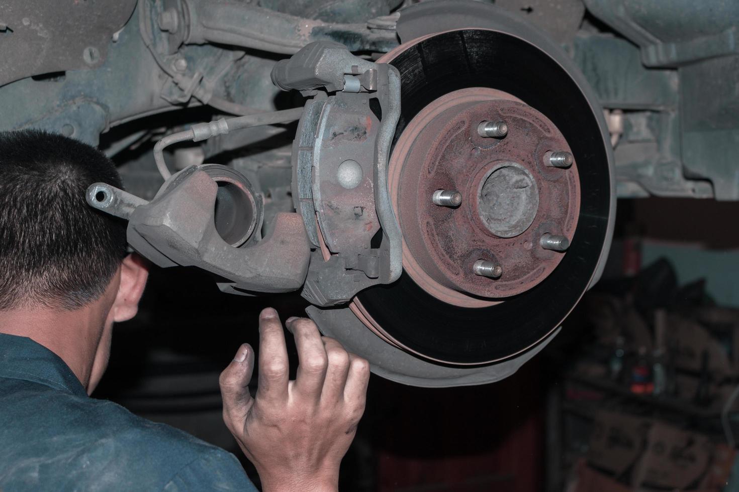 The mechanic is checking the engine. photo