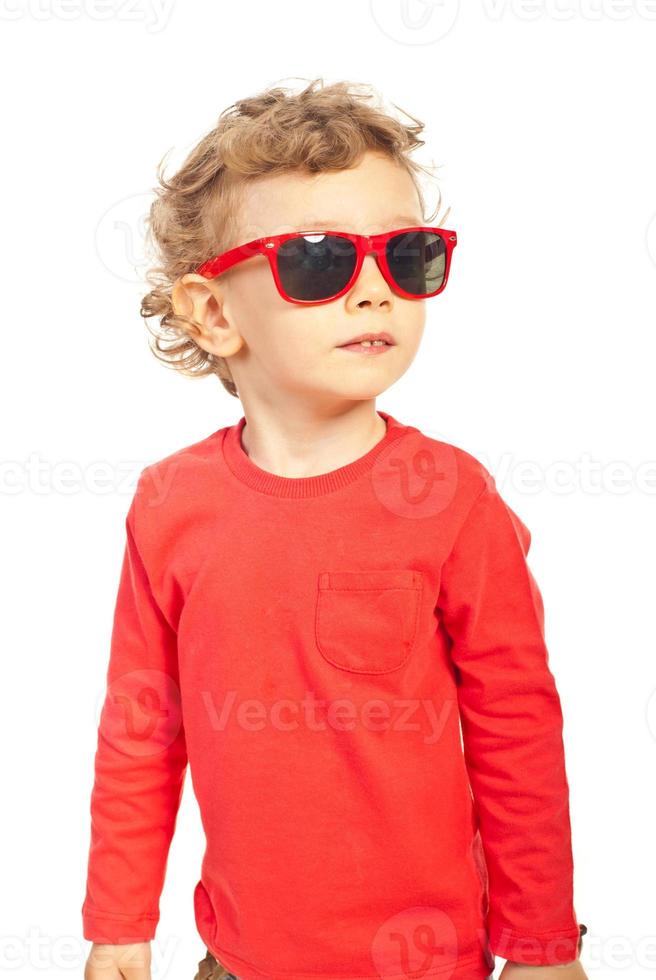 Modern kid boy with sunglasses photo