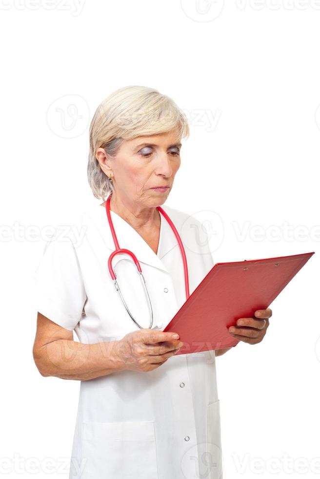Senior doctor woman with clipboard photo