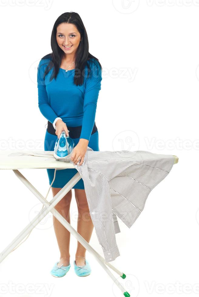 Happy woman ironing photo