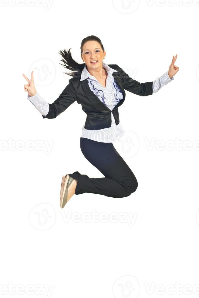 Victorious business woman jumping photo