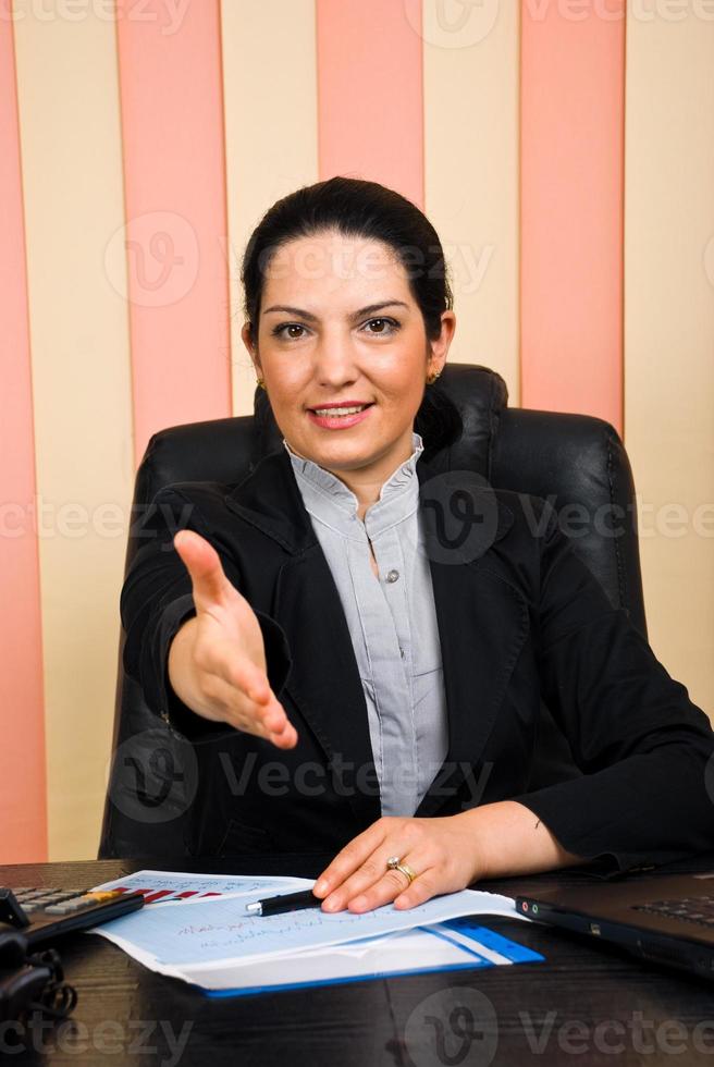 Business woman giving handshake or welcome photo