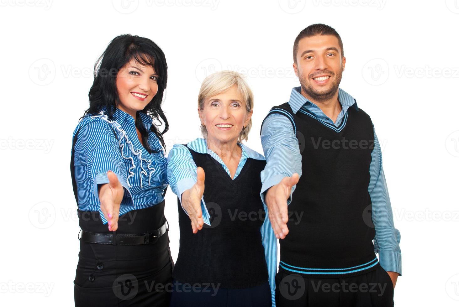 Cheerful office workers gives handshakes photo