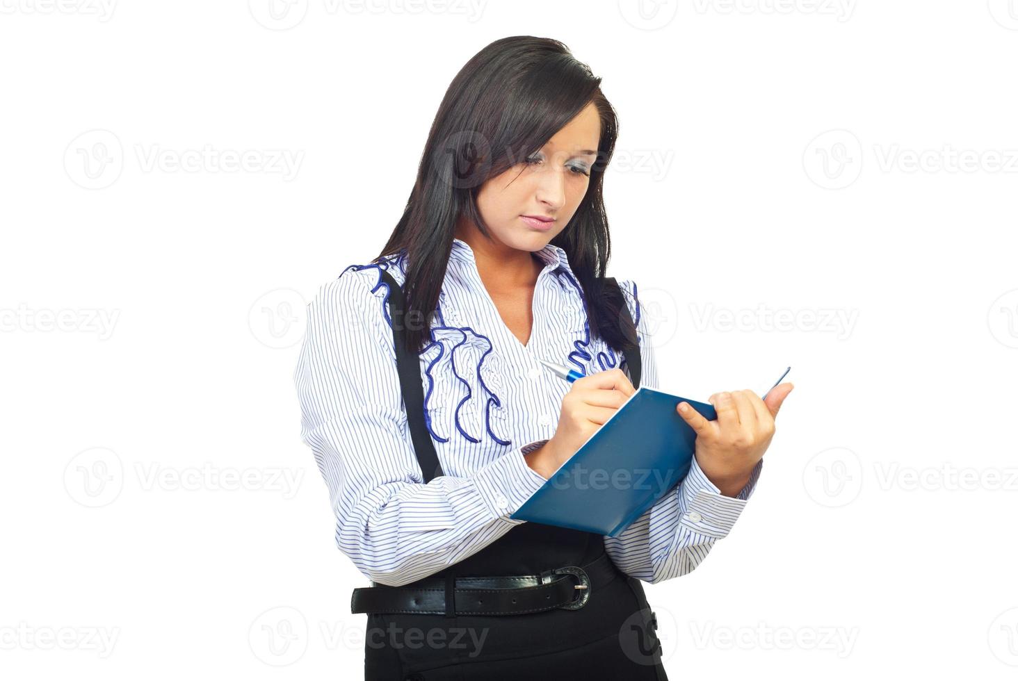 Secretary write in her agenda photo