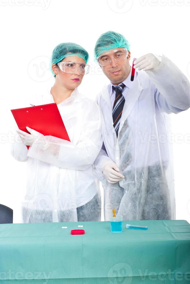 Two researchers with blood tube in laboratory photo