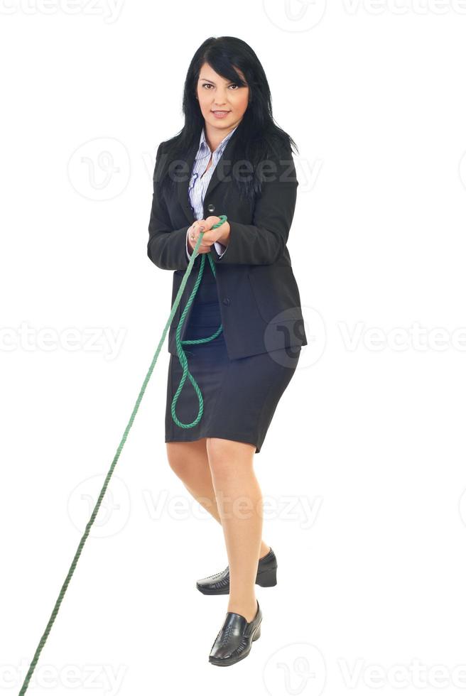 Business woman play tug of war photo