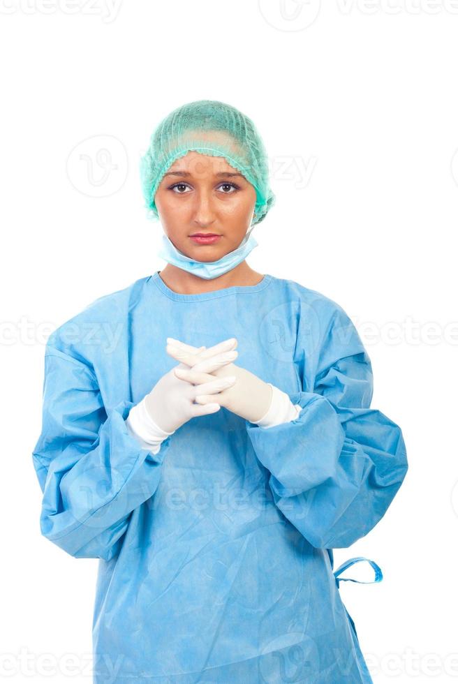 Serious surgeon woman with sterile gloves photo