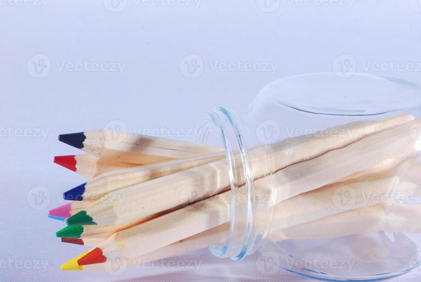 colored pencils in a glass jar photo