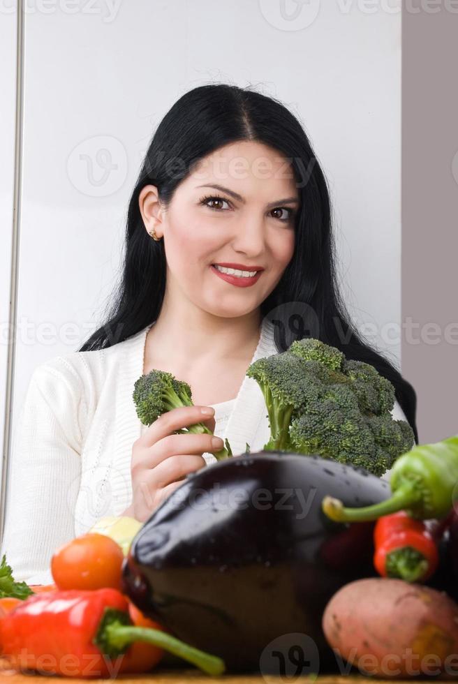 Woman with broccoli and vegetables photo