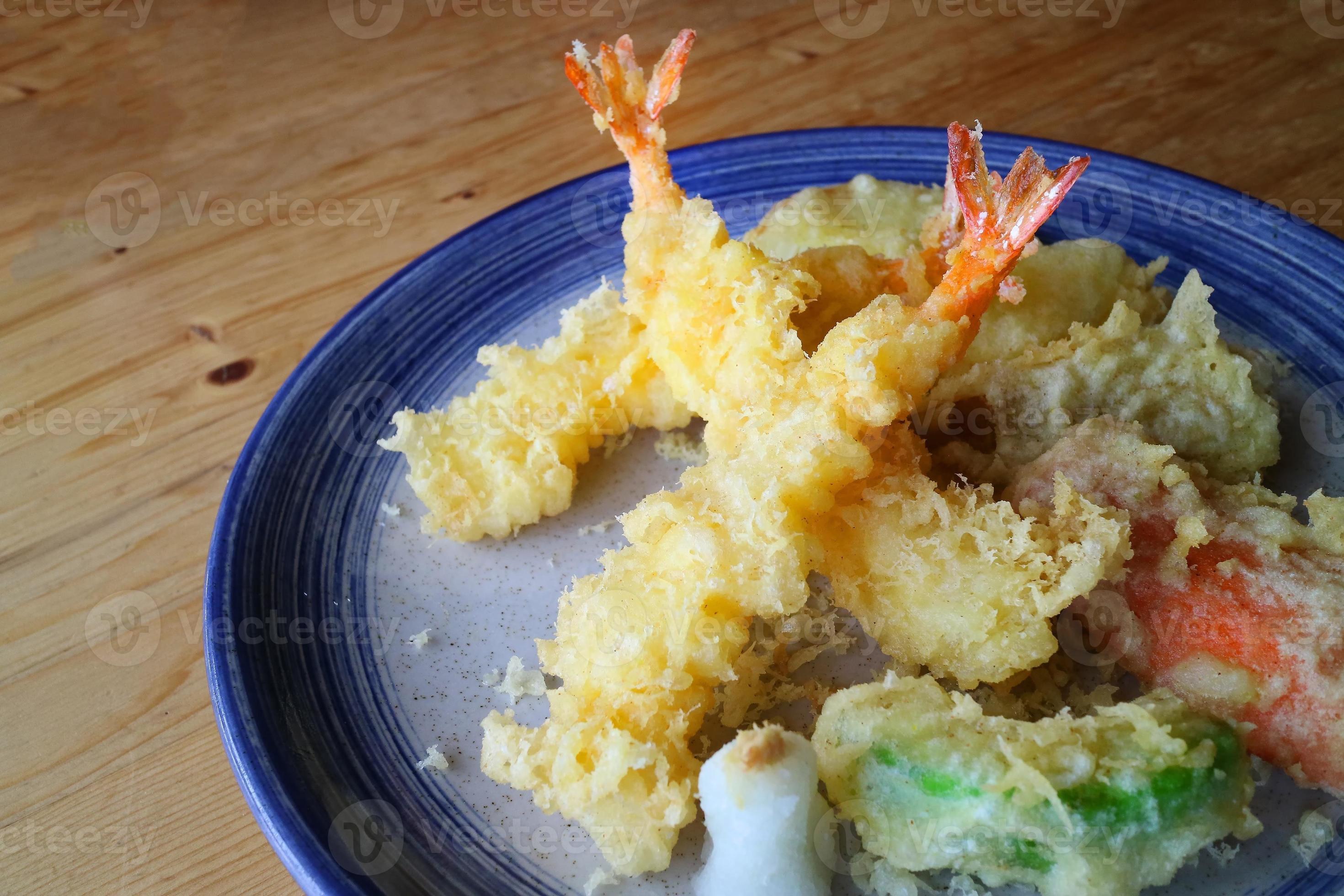 Japanese tempura with fresh vegetables deep fried and shrimp serve on ceramic round plate