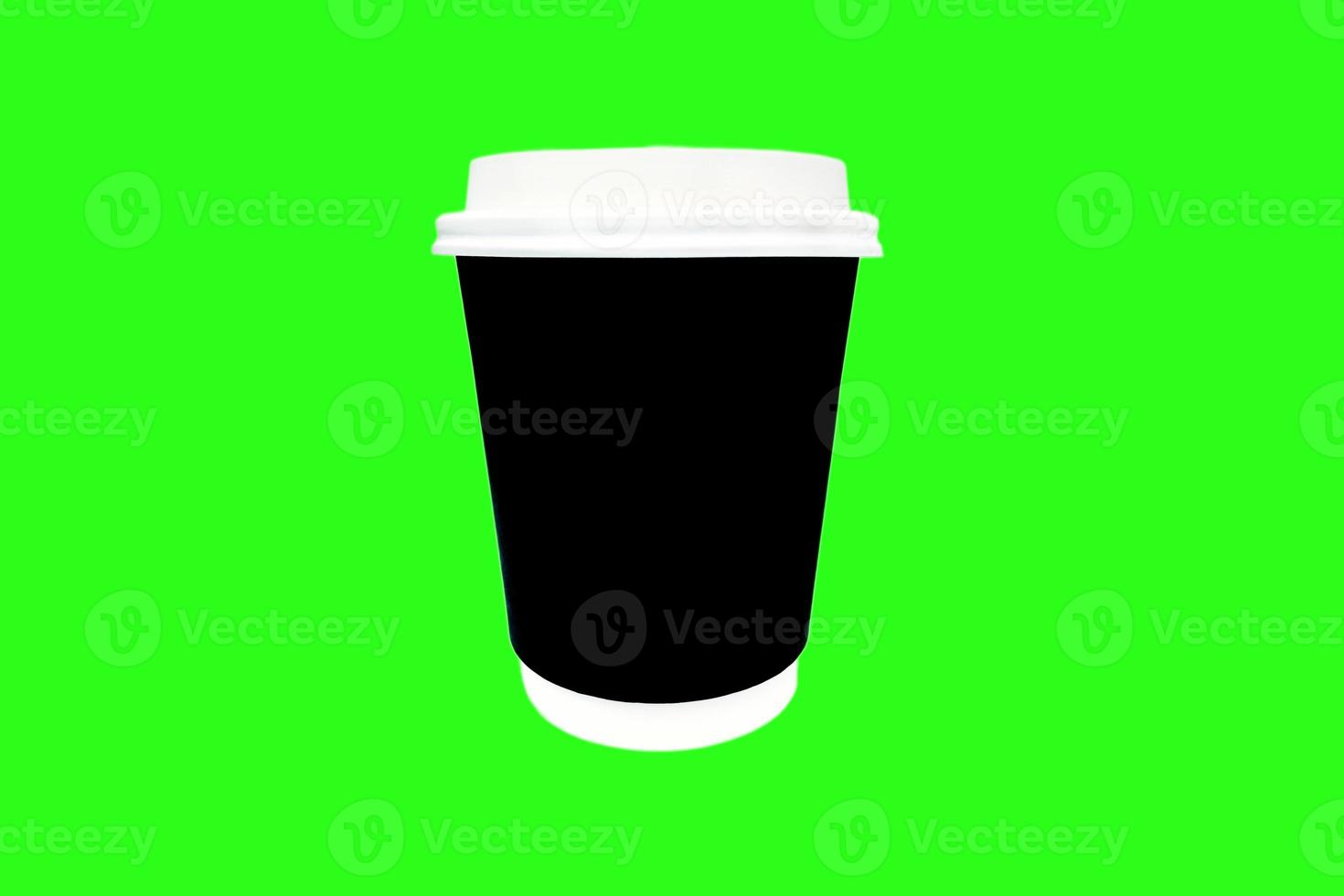 Black coffee cup on green background. photo