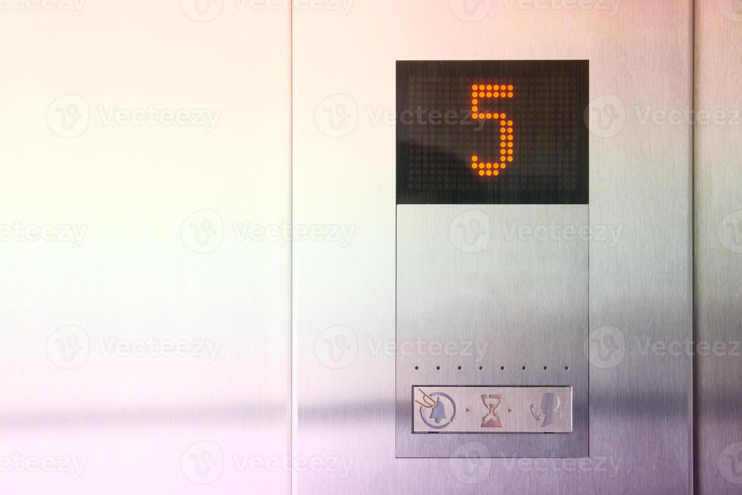 Monitor show number 5 floor in metal modern elevator photo