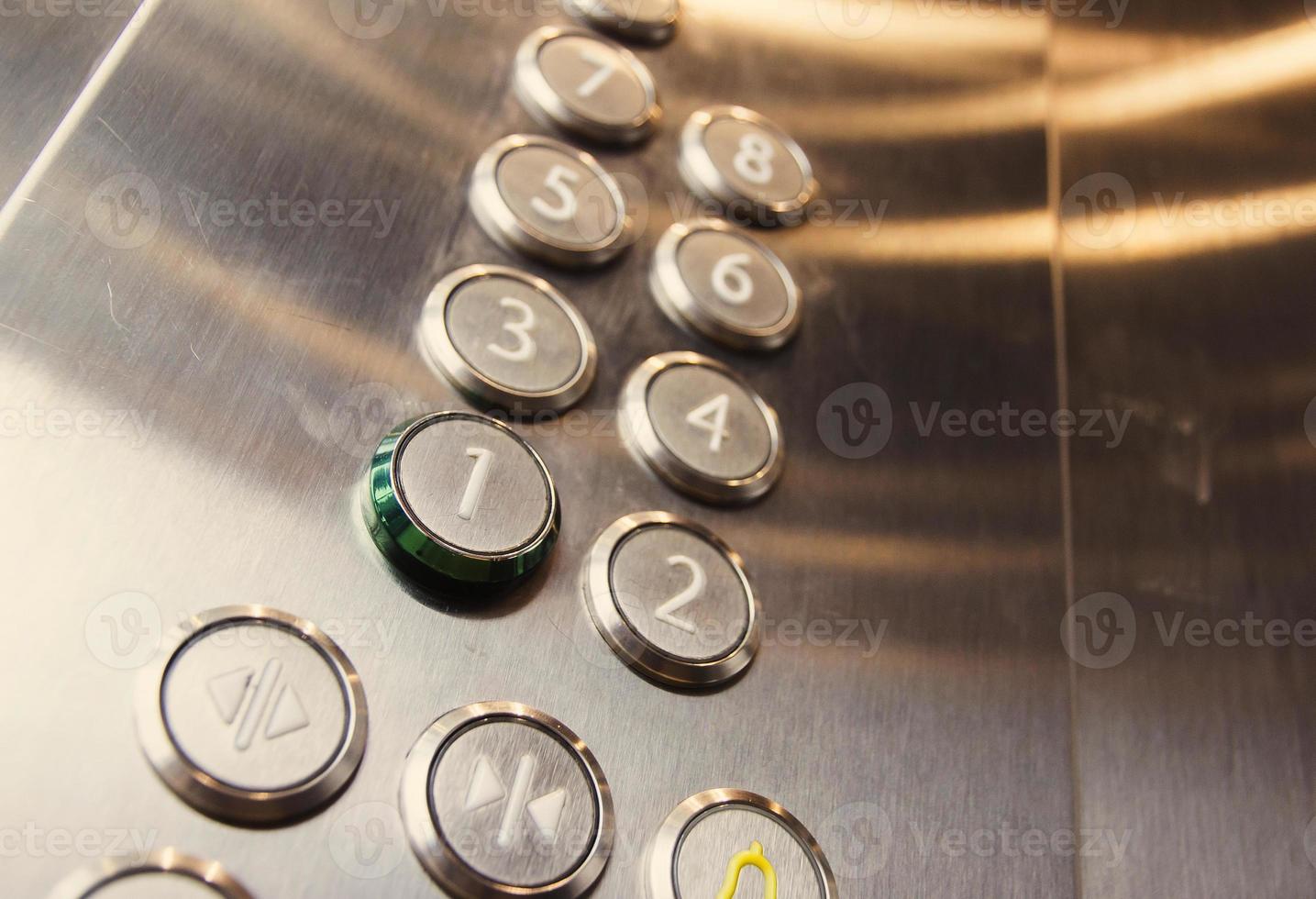 Button lift metal modern business center close-up photo