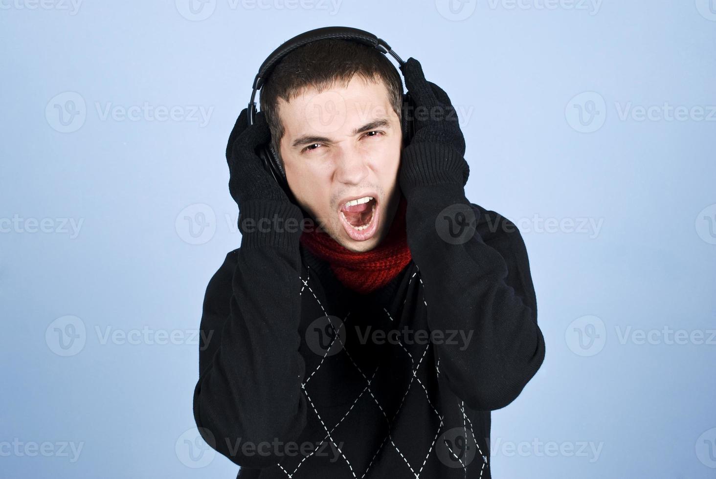 Cool guy enjoying music extremly photo