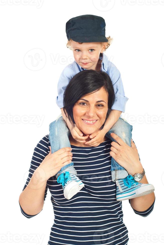 Boy riding mother in piggy back photo