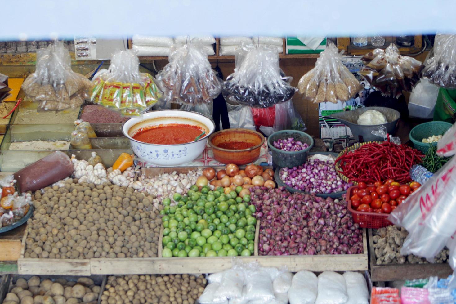 A collection of kitchen spices for cooking food neatly arranged in a simple market photo
