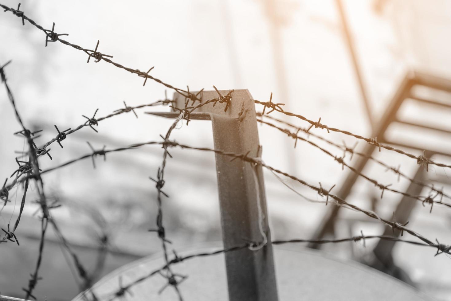 barbed wire fence lack - symbol of danger photo