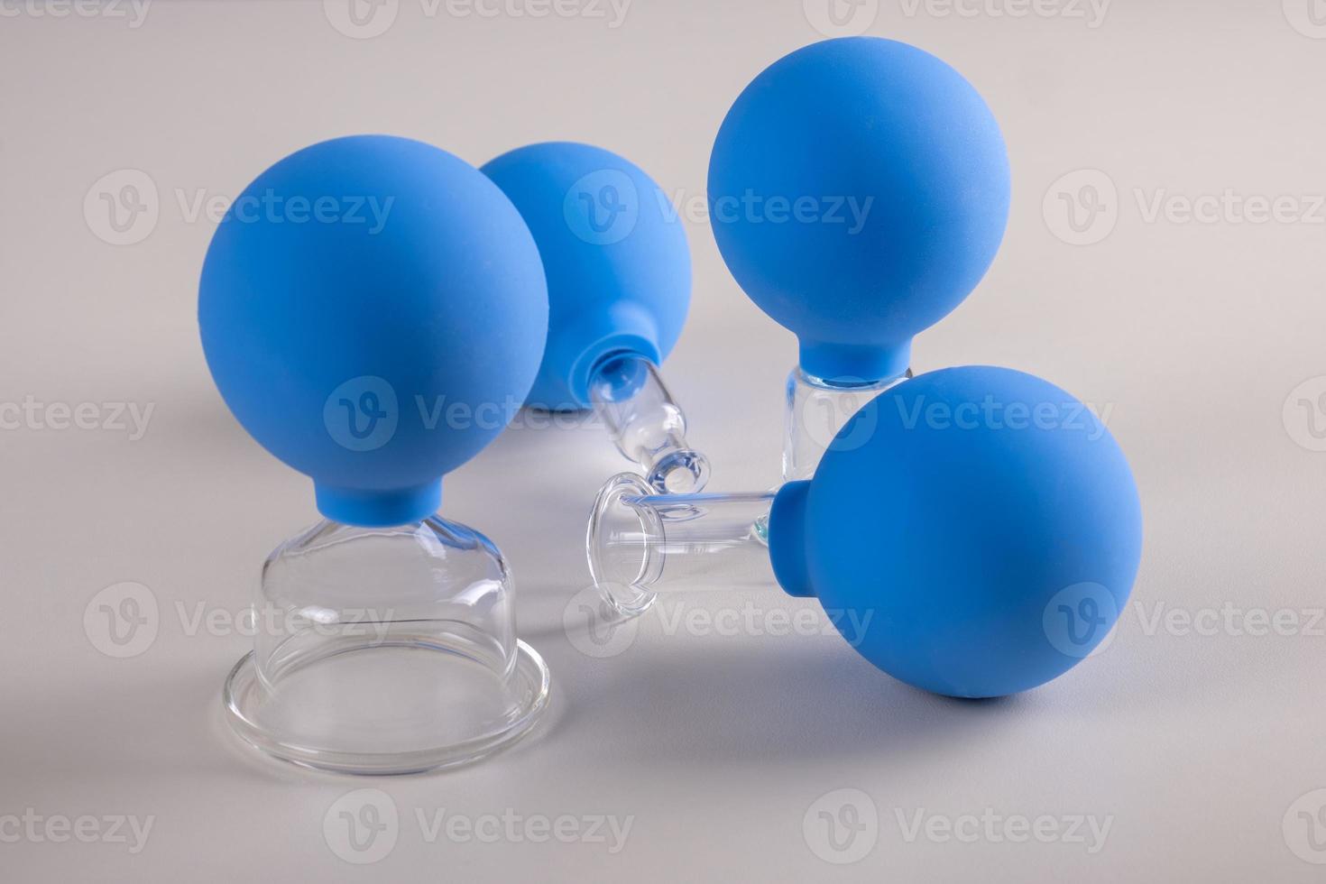 Vacuum pot for vacuum facial massage stands on a table photo