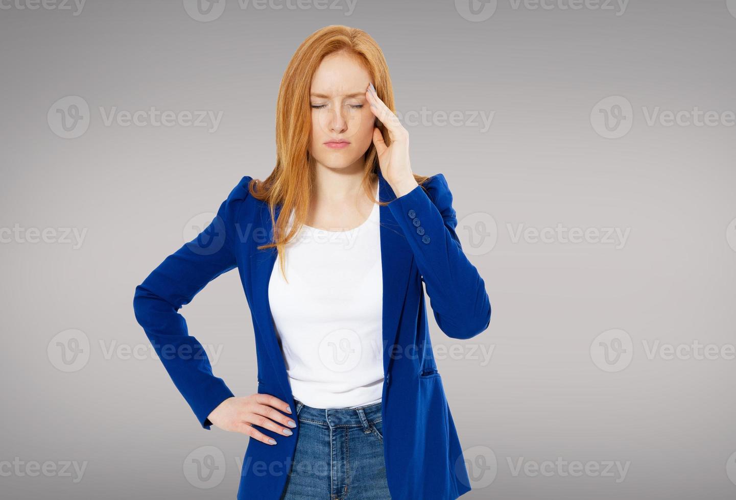 Stressed Exhausted Young Red Hair Woman Having Strong Tension Headache. Closeup Portrait Of Beautiful Sick Girl Suffering From Head Migraine, Feeling Pressure And Stress. High Resolution Image photo